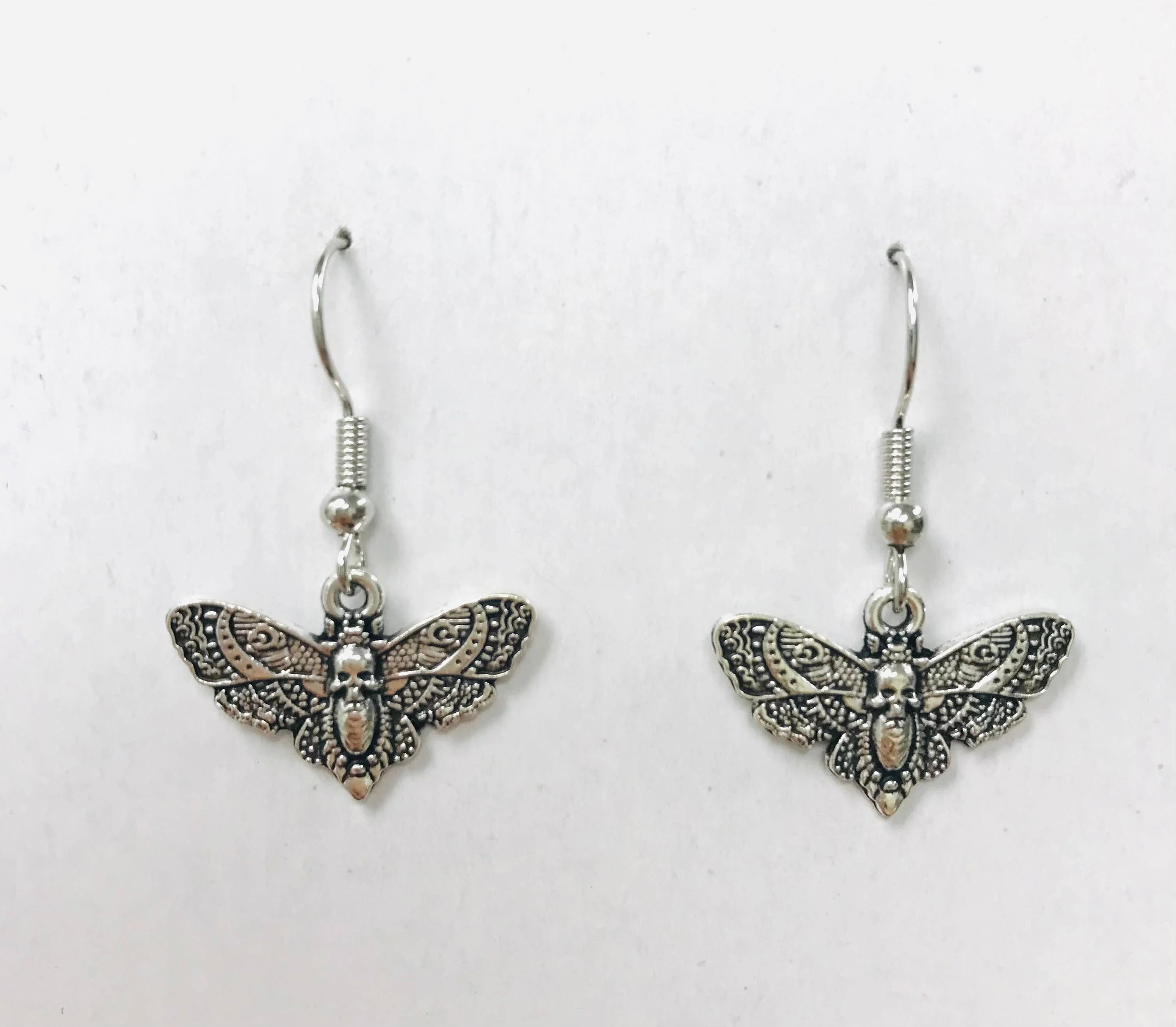 Tiny Silver Death Moth Earrings - Image 2